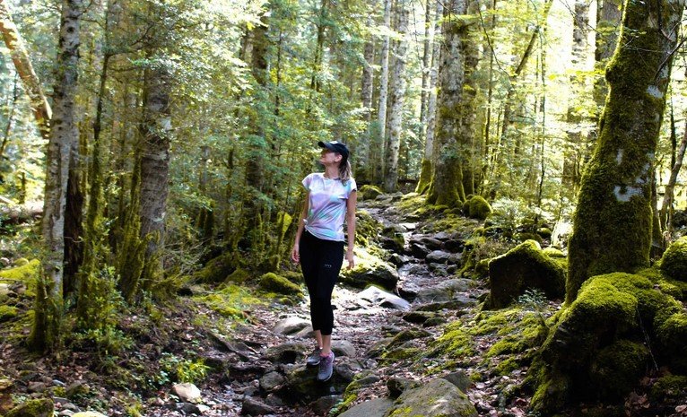 a woman taking a nature walk